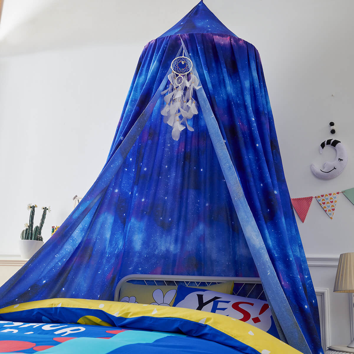 Blue Starry Sky Kids Bed Canopy hanging over the head of a metal-framed single bed, creating a cozy and magical feel.