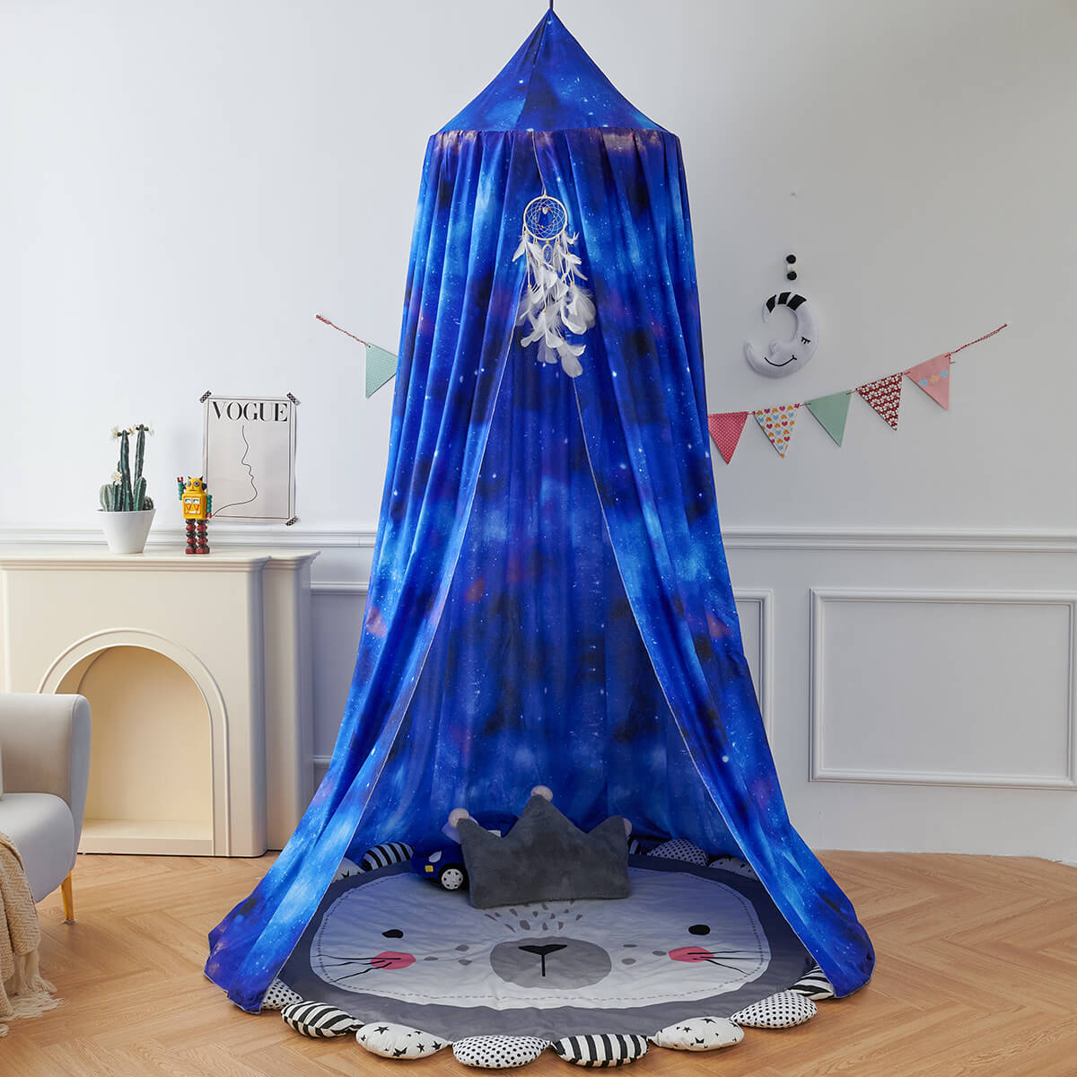 Blue Starry Sky Kids Bed Canopy set up as a play nook with a lion-shaped mat and a gray crown pillow.