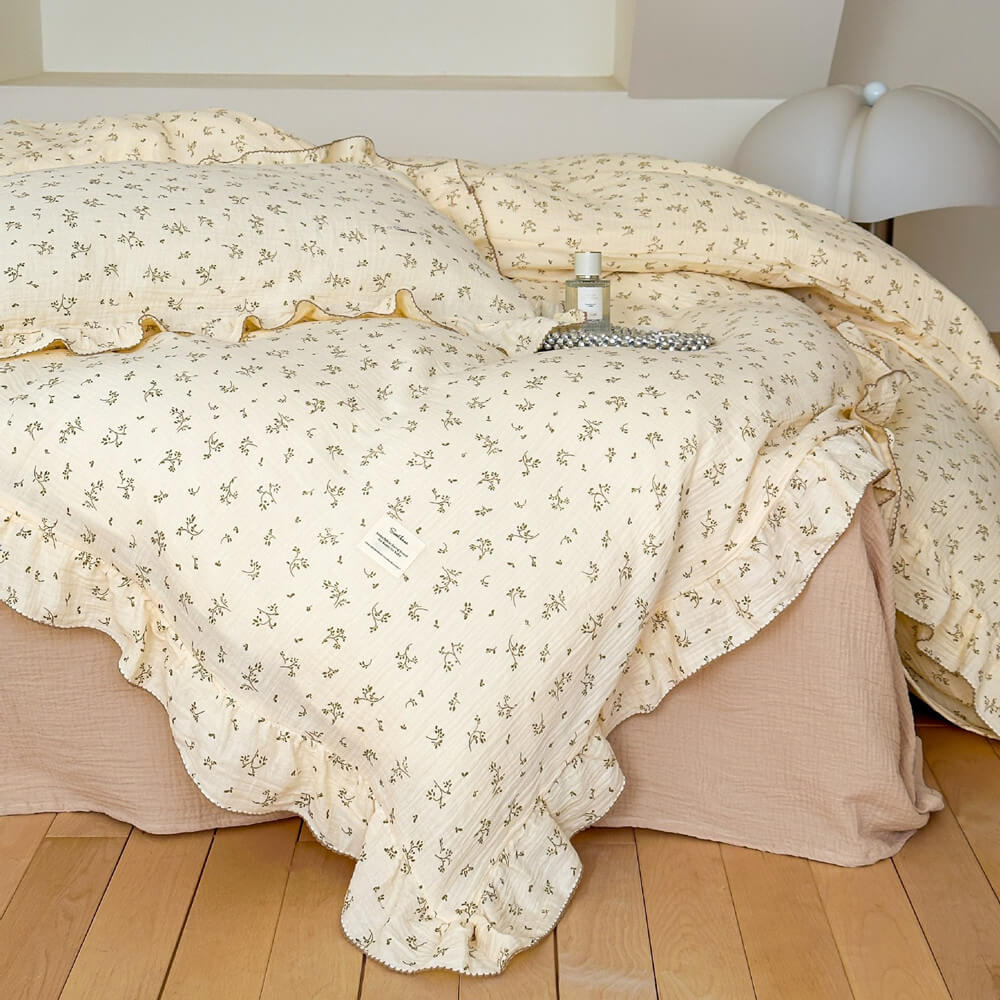 Reversible cotton muslin duvet cover with floral pattern and ruffle edges