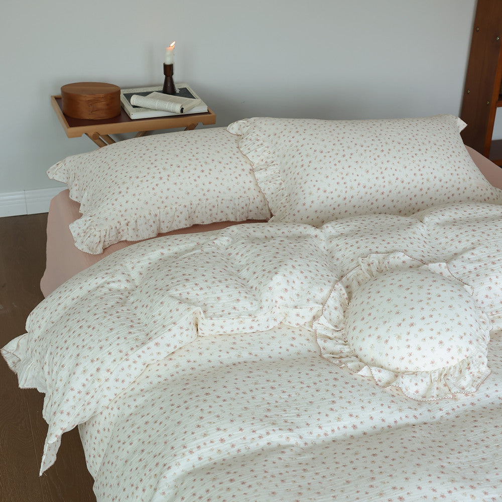 Detailed shot of pillow and comforter with dainty floral design