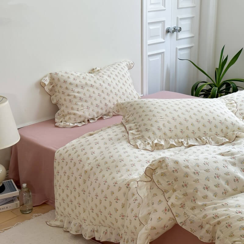 Ruffled Azalea floral bedding set in cotton muslin, with duvet cover, pillow shams, and matching colored crinkled cotton flat sheet.