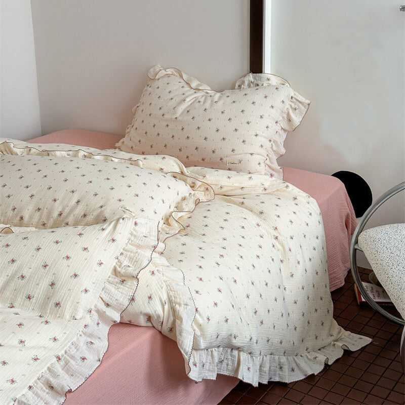 Vintage petite rose floral cotton bedding set with ruffle trim on cream muslin