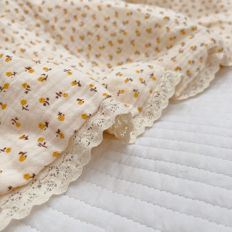 Yellow daisy floral baby quilt with lace edge
