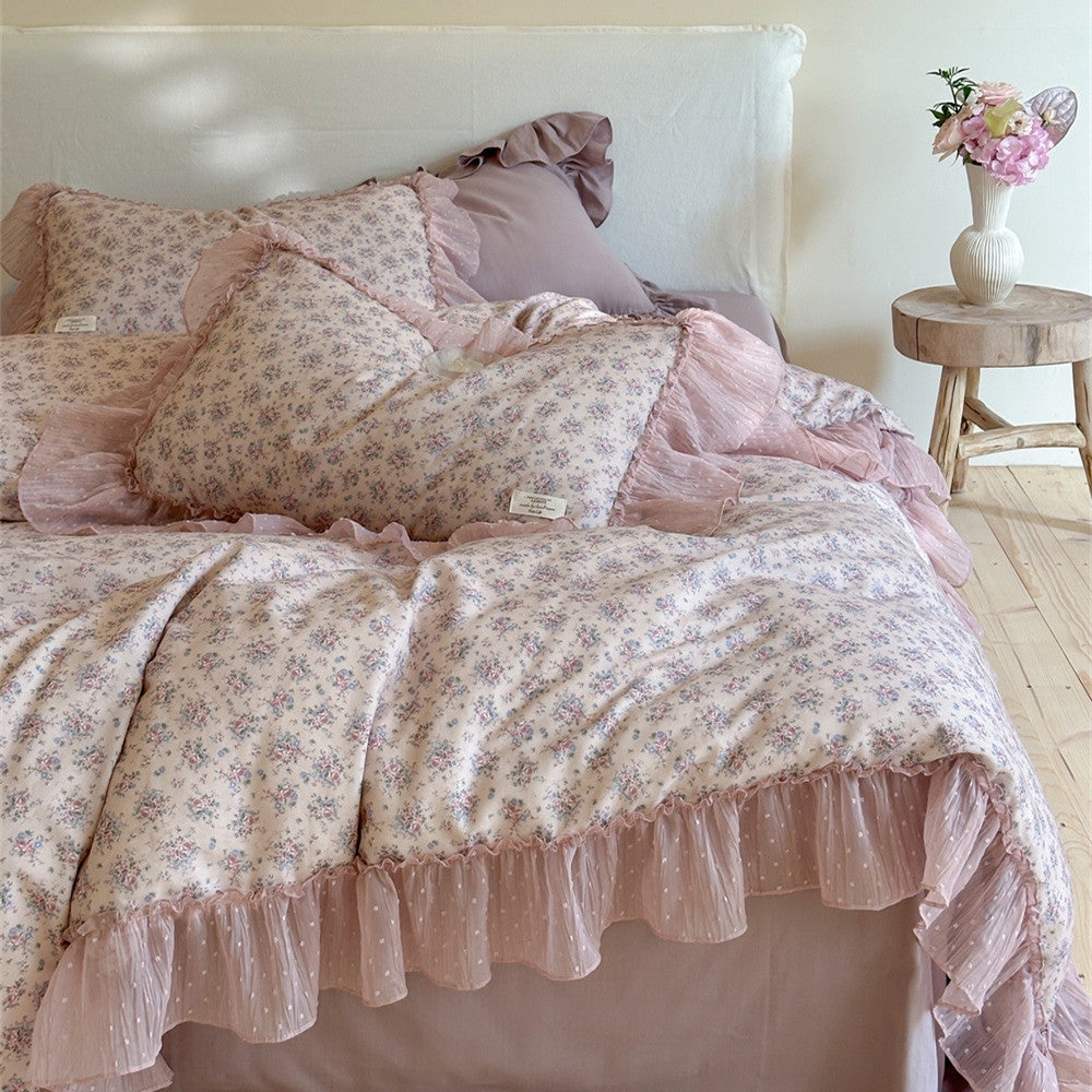 Elegant full view of the Lavender Floral Gauze Bedding Set, featuring the duvet, pillows, and bed skirt, all detailed with sheer chiffon ruffles for a romantic cottage style.