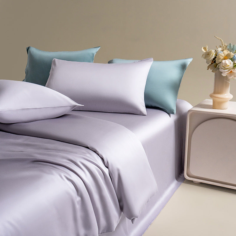 Full-size silky Lyocell bedding set in a luxurious lavender hue, featuring matching sheets and pillowcases