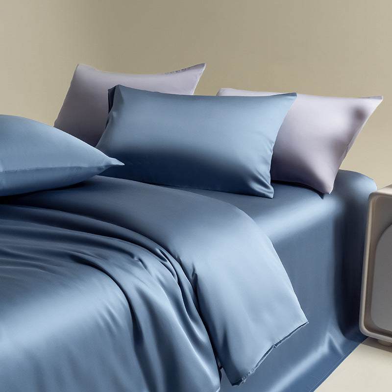 Solid color silky Lyocell bedding set in a rich navy blue, showcasing the luxurious comfort and smooth, draping texture of the fabric.