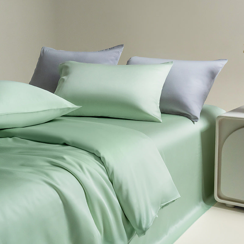 Silky Lyocell bedding set with pillowcases in a mint green color, highlighting the material's luxurious feel and silky smooth sheen.