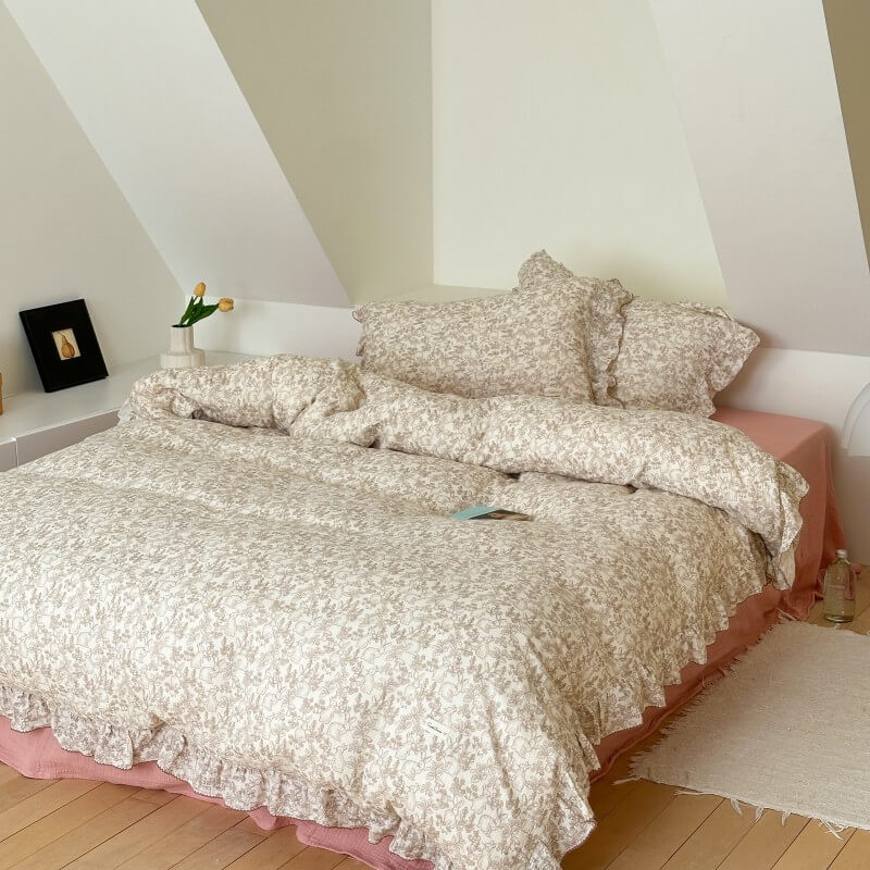 Full bed with woodland animal print ruffled duvet and dusty rose cotton sheet