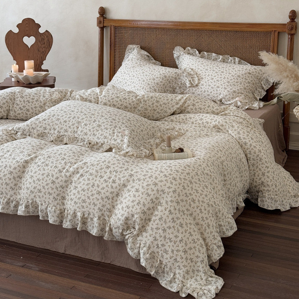 Another perspective of the bedding set, highlighting the natural drape and fluffiness of the duvet cover, as well as a wooden chair with a heart-carved headboard, creating a cozy and vintage feel.