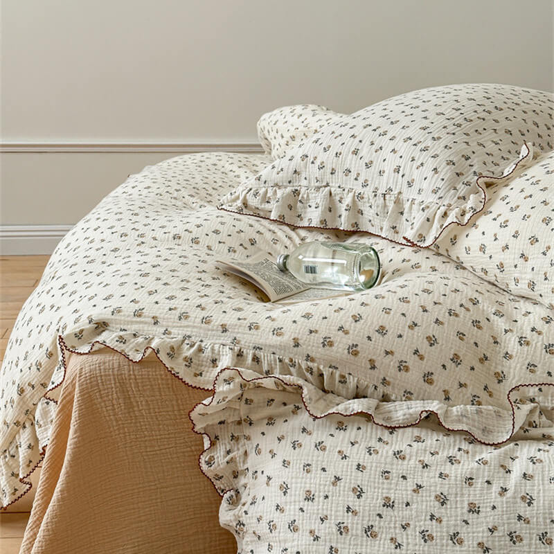 Delicate rose floral print bedding set with ruffle trim