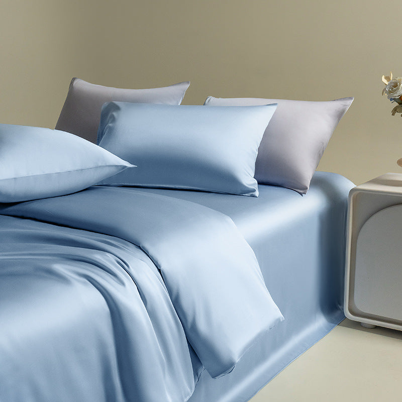 Silky Lyocell bedding set with pillowcases in a blue color, highlighting the material's luxurious feel and silky smooth sheen.