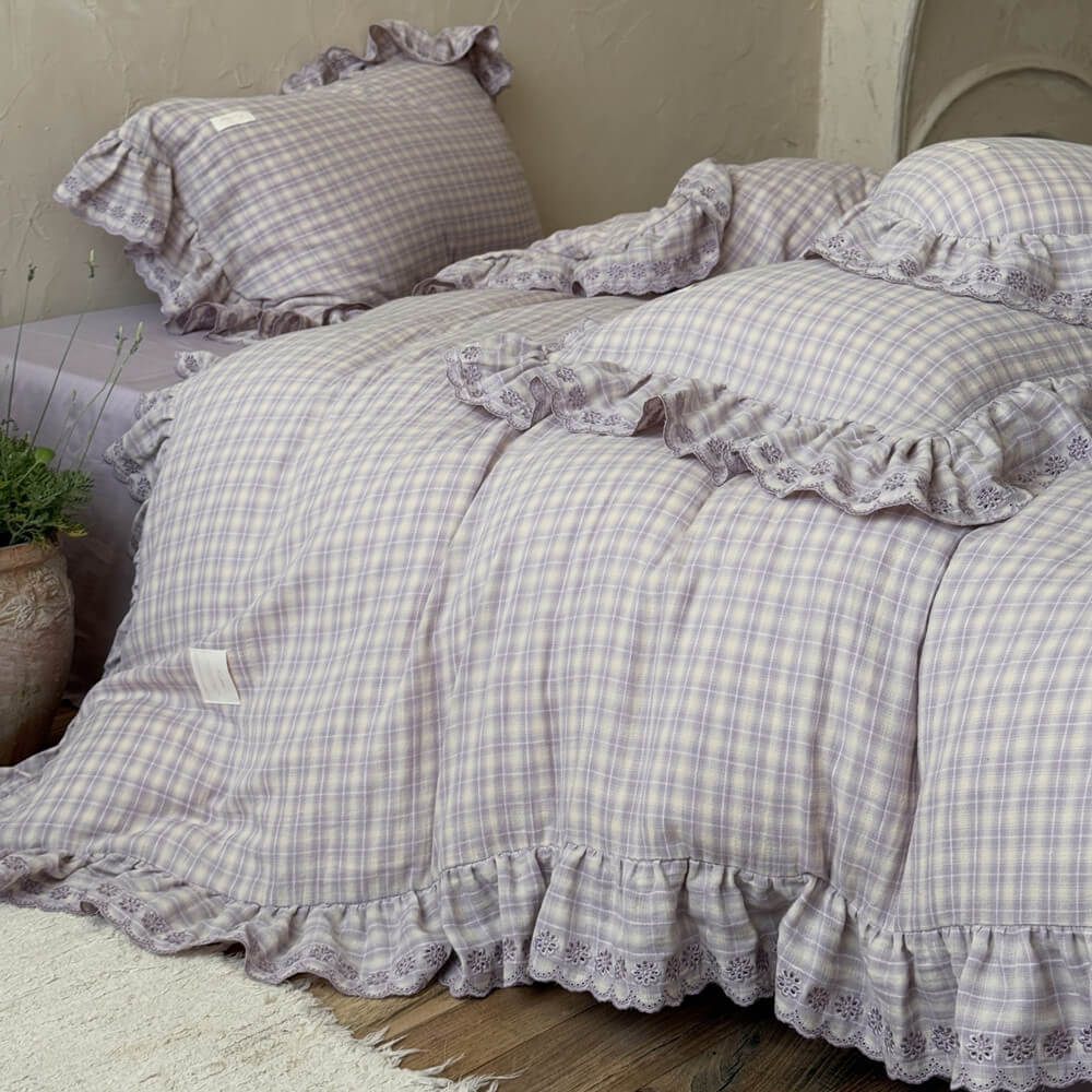 Side view of lavender plaid ruffle bedding set with matching pillowcases