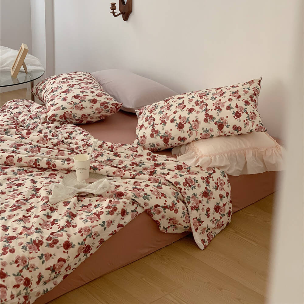 Full display of the Soft & Romantic Vintage Rose Knit Cotton Bedding Set in a cozy corner bedroom setting.