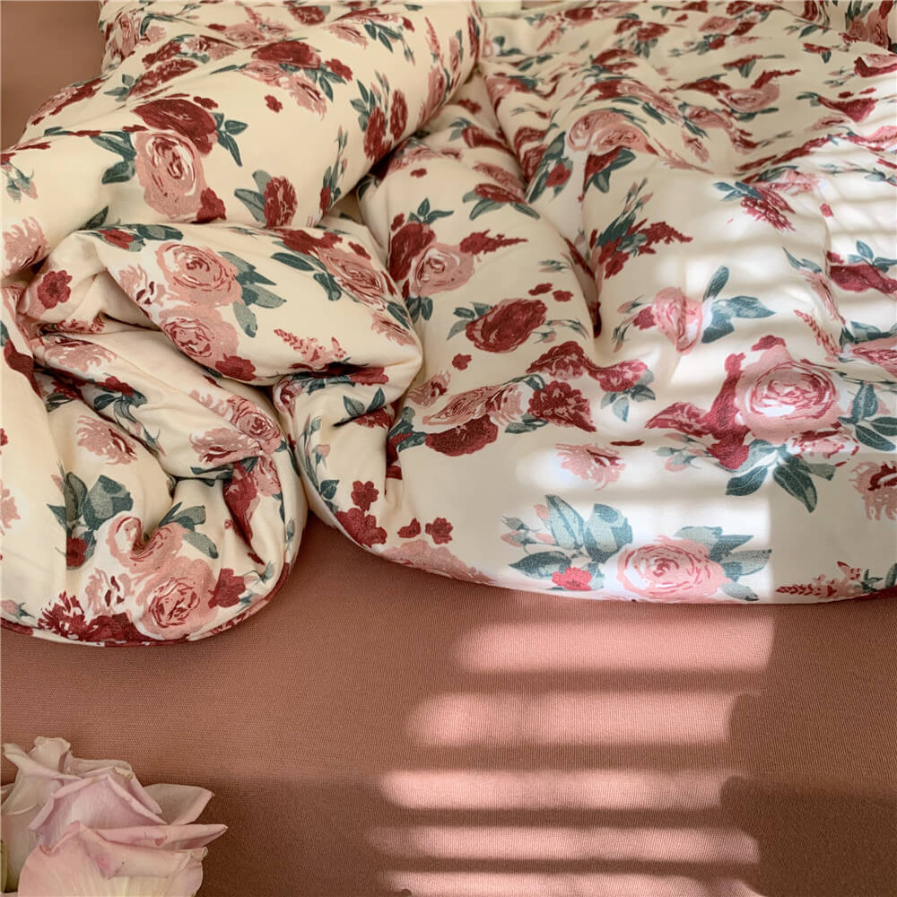 Detail of the Vintage Rose Knit Cotton Bedding Set, emphasizing the soft texture and detailed rose print.