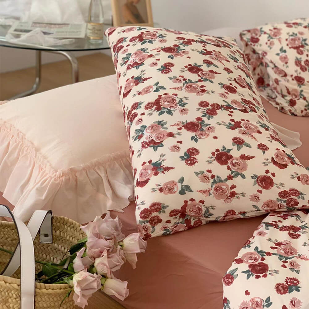 Close-up of the Vintage Rose Knit Cotton Bedding Set pillowcases, highlighting the soft, romantic floral pattern.