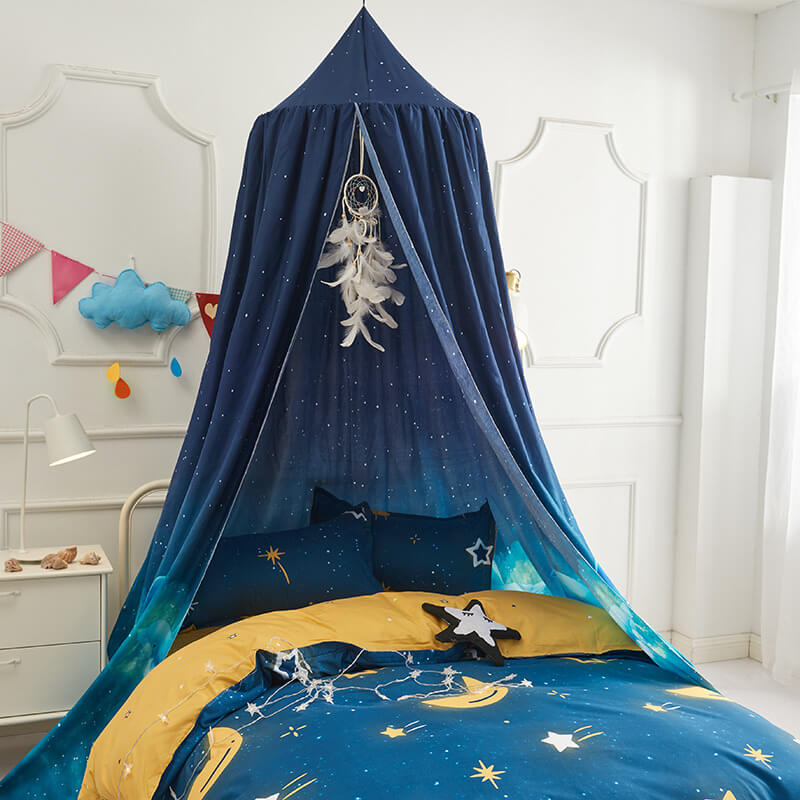 Blue gradient star and universe bed canopy for kids, shown with matching bedding.