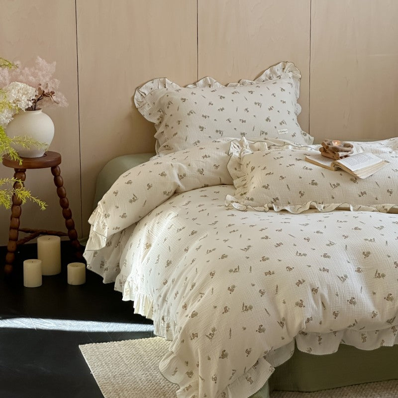 Bunny Print Duvet Cover Set with Ruffled Cotton Muslin on bed