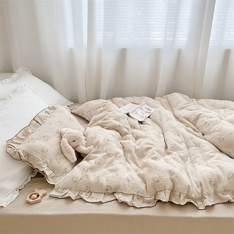 Twin bed styled with bunny print cotton muslin ruffled bedding