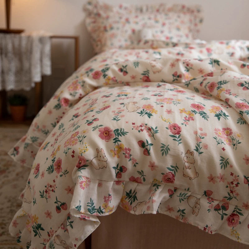 A detailed photo of the pink floral bunny bedding set, focusing on the cute rabbit and flower pattern on the soft, crinkled fabric