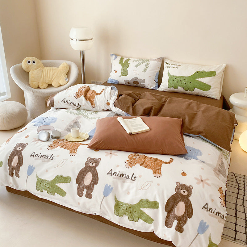 A side view of the animal print bedding, focusing on a pillowcase with a green cartoon alligator