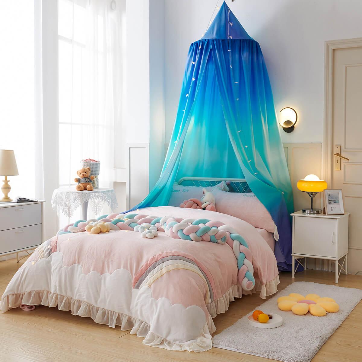 Ombre blue gradient bed canopy with a star print, shown on a twin bed.
