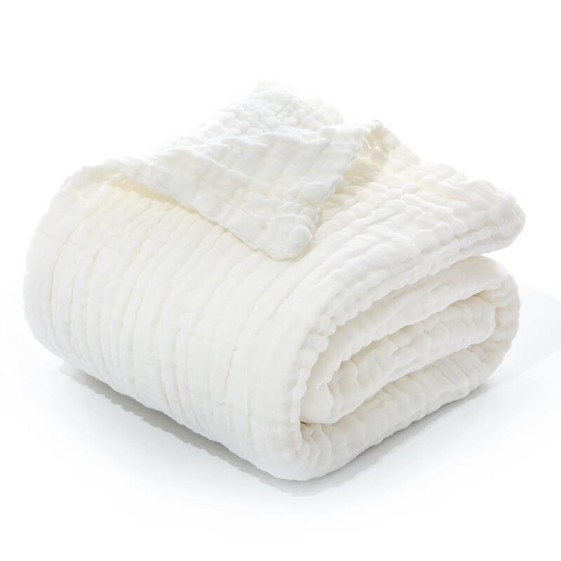 Folded 6-layer cotton muslin blanket for newborns in a classic solid white.