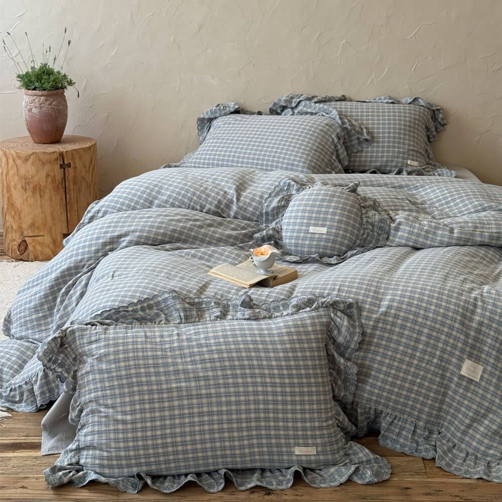 Dreamy bedroom with dusty blue plaid ruffle bedding set and natural wood decor