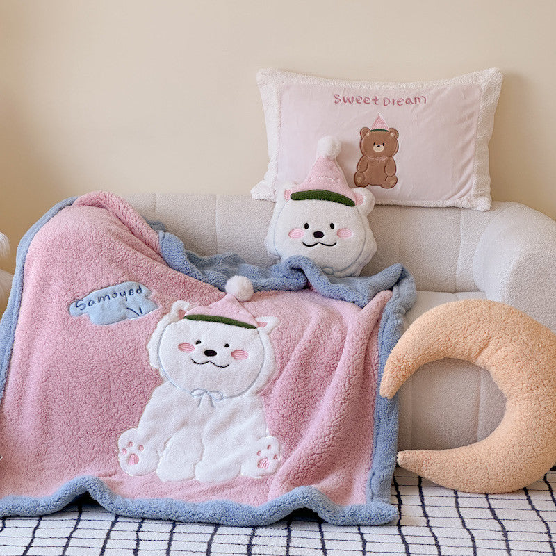 Pink and blue sherpa throw blanket with a fluffy Samoyed dog design.