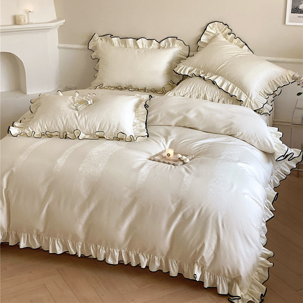 Floral jacquard texture on ivory satin bedding with ruffled pillowcase