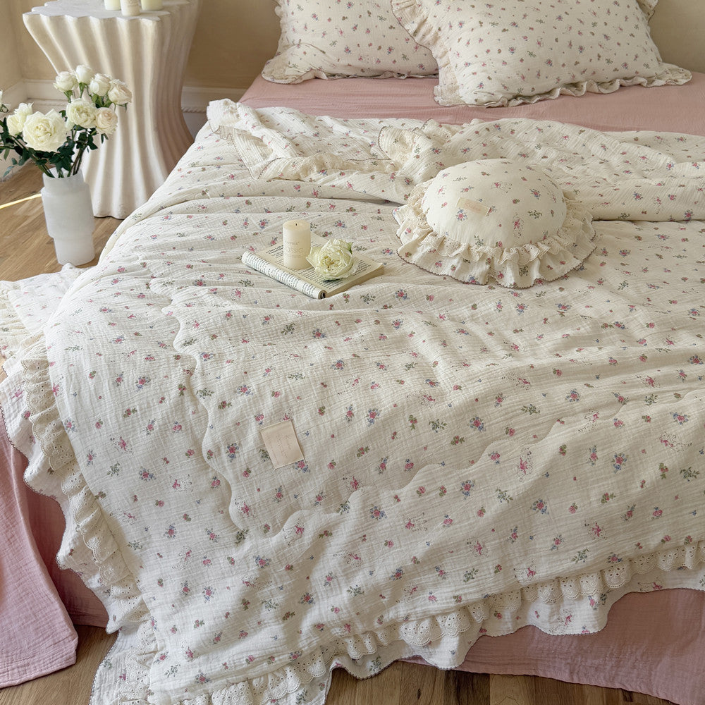 Pink floral cotton comforter with soft gauze texture and ruffled edge