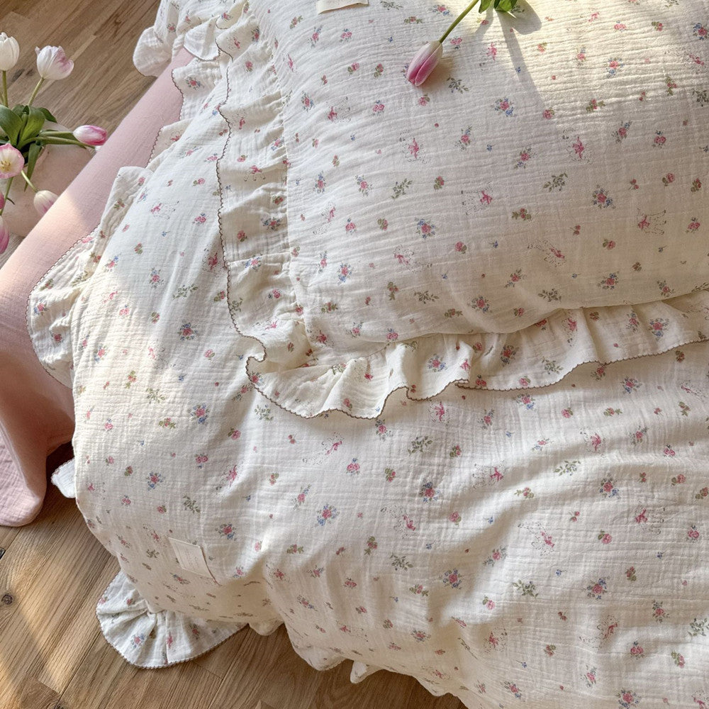 Soft cotton gauze bedding with floral and lamb print on a pink sheet