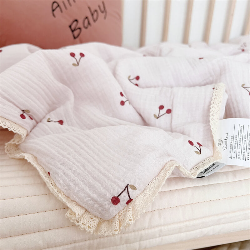 Detailed view of cherry print and cotton muslin texture