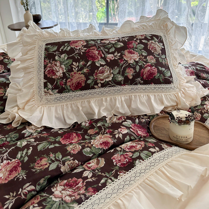 Pillowcase with ruffled lace edge in dark rose print bedding