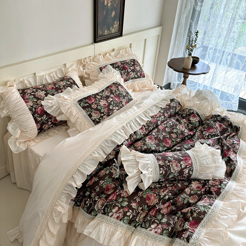 Side view of dark floral bedding with lace and ruffles