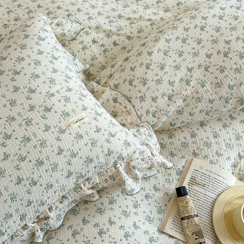 Close-up of green floral muslin duvet cover and ruffle pillowcase