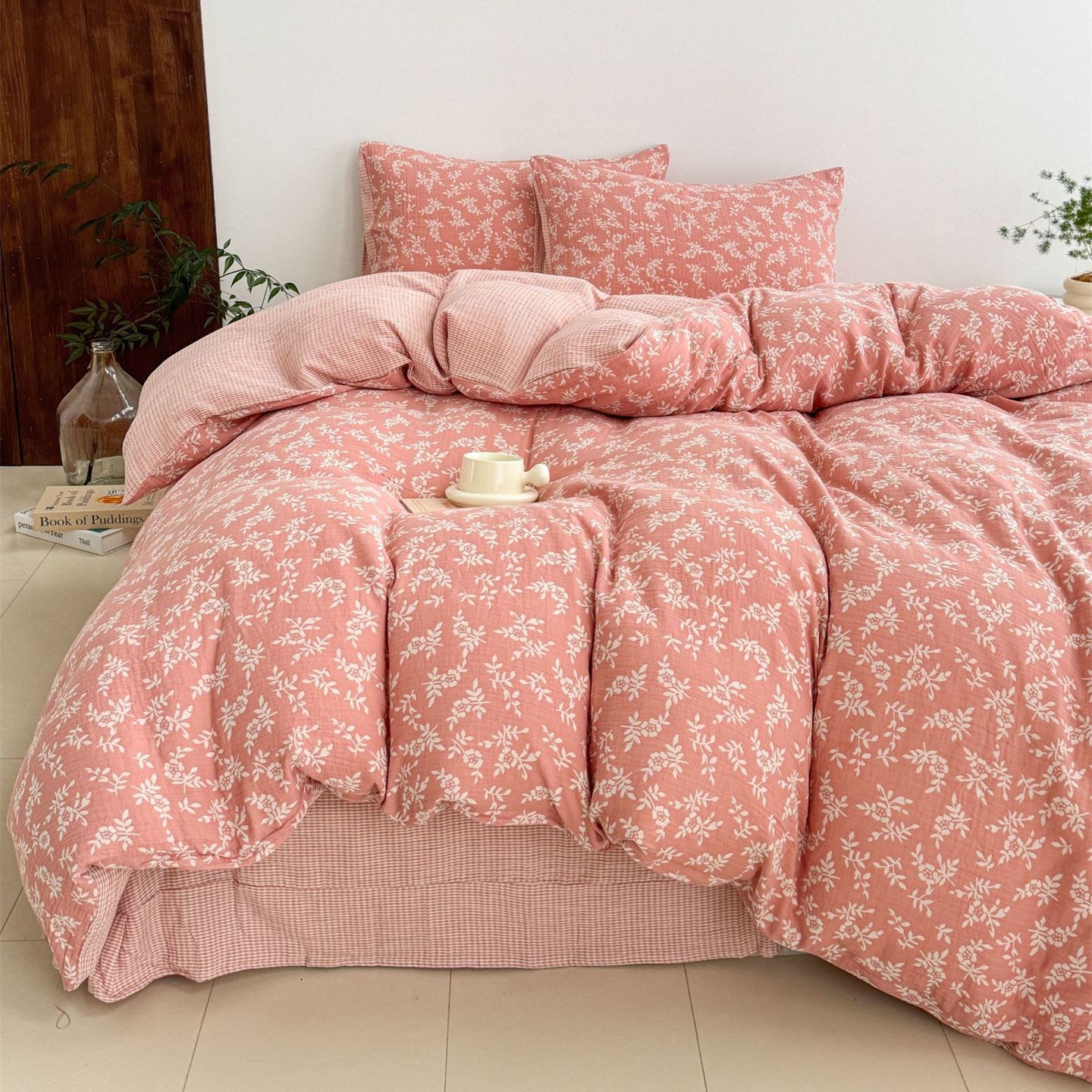 A cozy bed styled with a pink jacquard cotton duvet cover set, showing the woven leaf pattern and the light, breathable fabric.