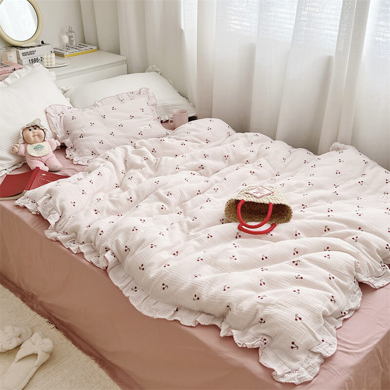 Cherry print bedding set and ruffled pillowcase in girls’ room