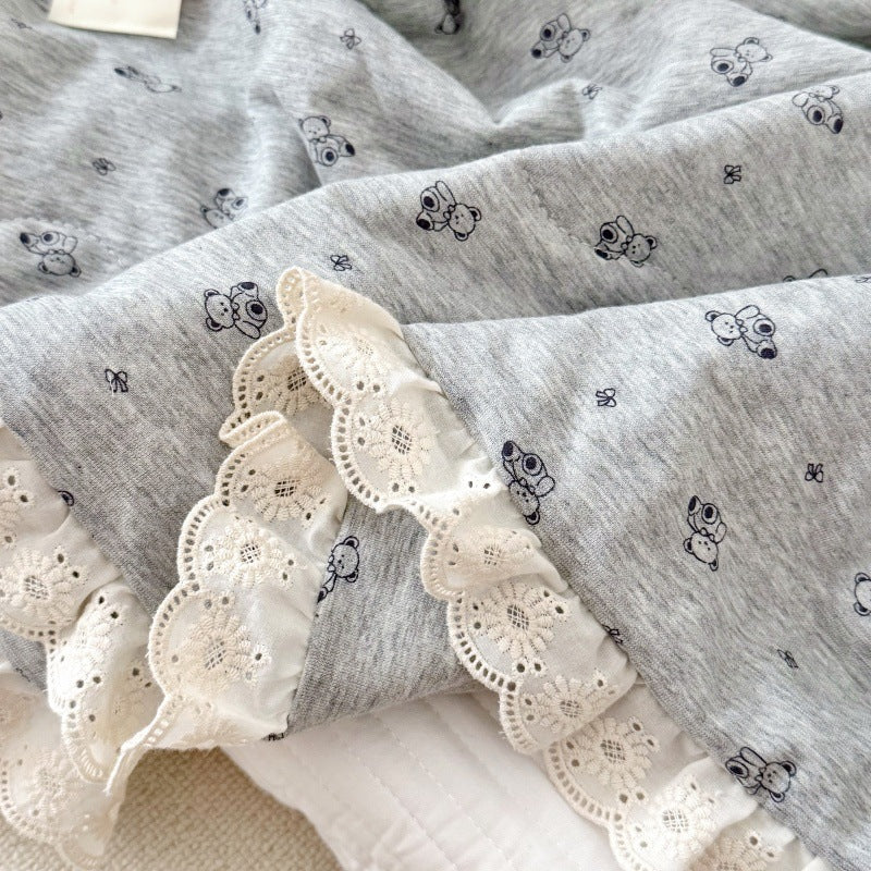 Lace trim detail on baby comforter in soft grey jersey