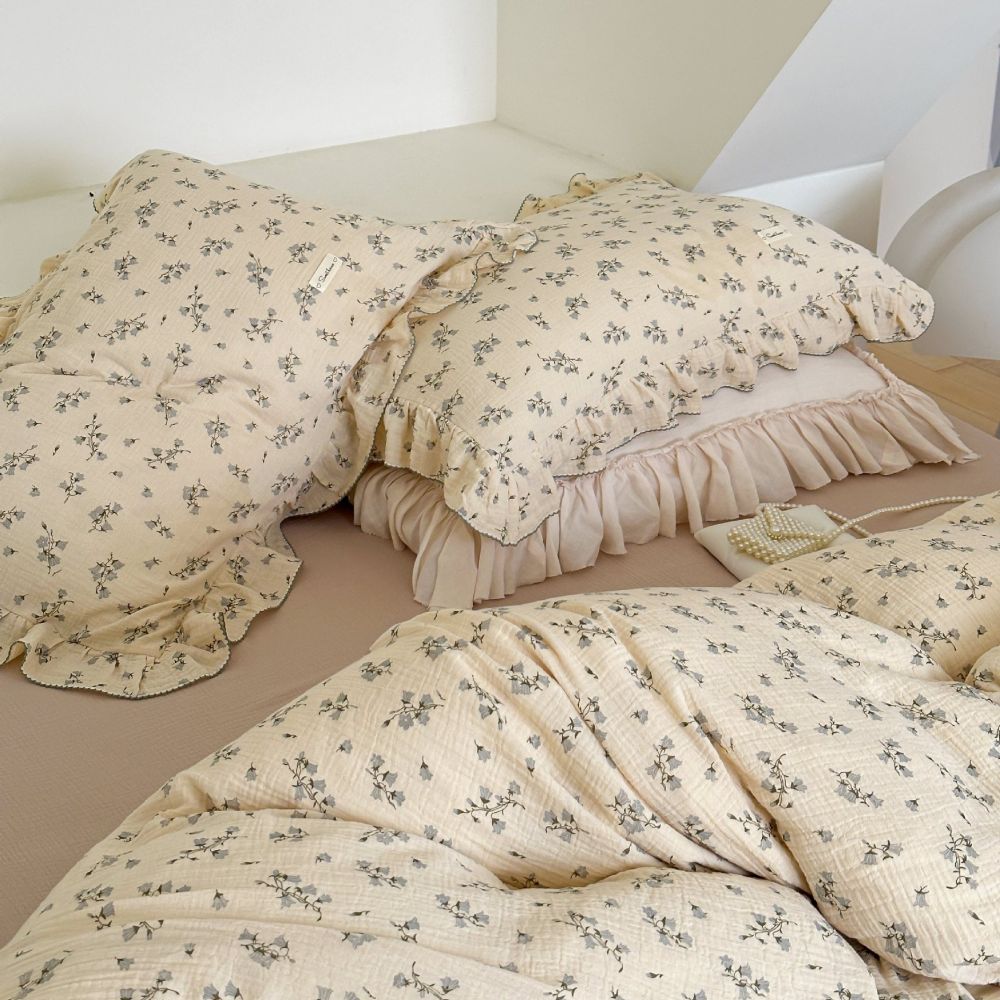 Beige floral duvet cover set styled with soft pillow and khaki cotton sheet