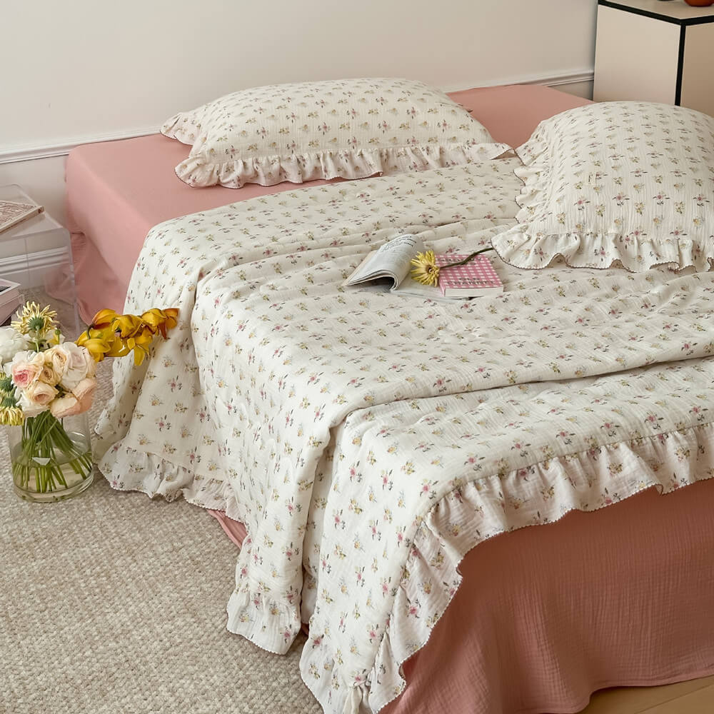 vintage floral quilt and pillowcase on bed