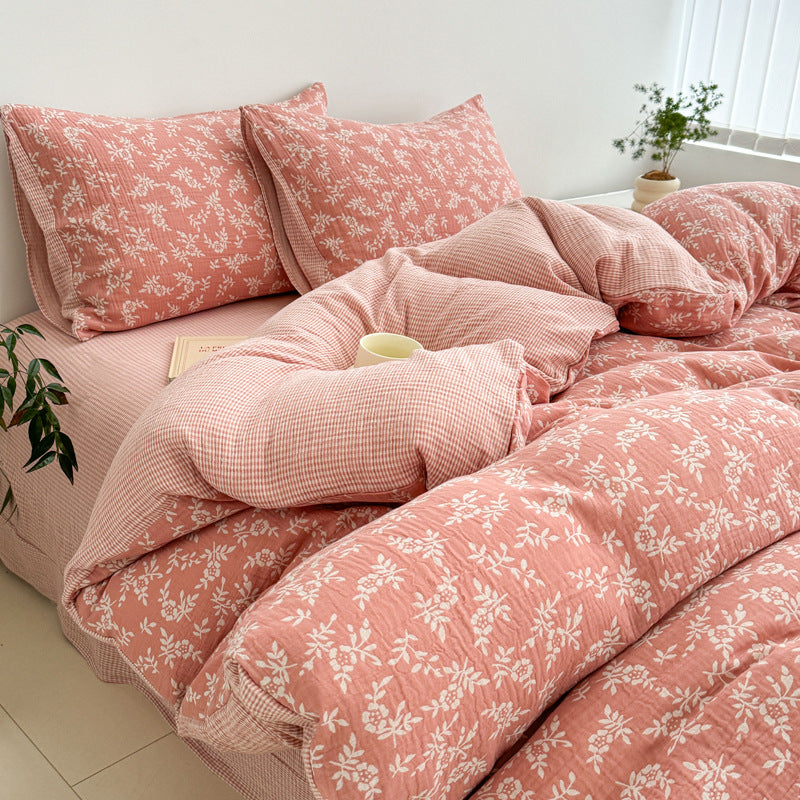 A side view of the pink jacquard cotton duvet cover on a bed, emphasizing the softness and the detailed woven design.
