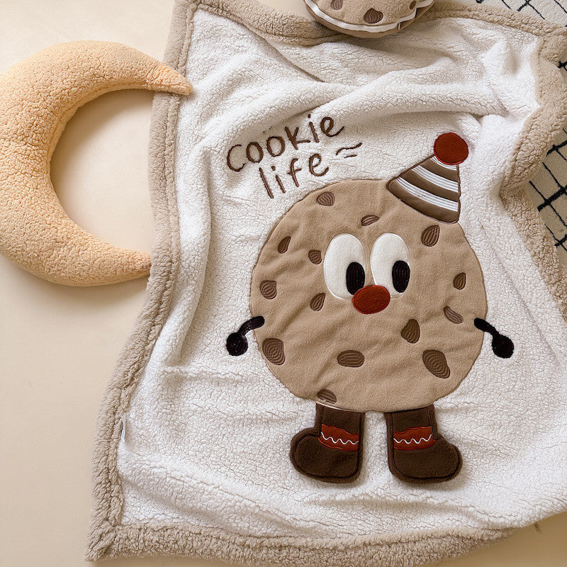 A soft plush sherpa baby blanket featuring a cookie character with "Cookie life" embroidered text.