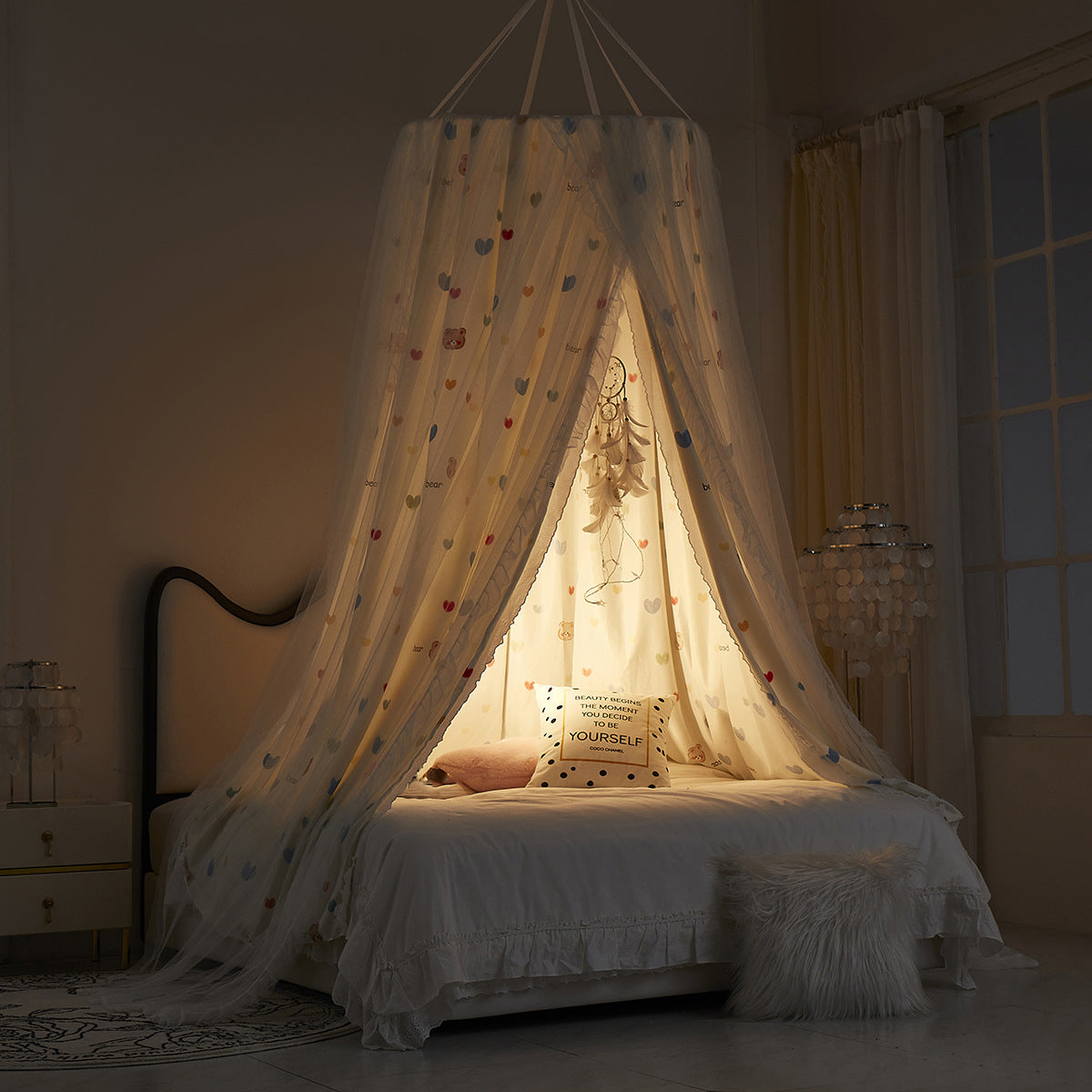 Glowing princess canopy at night with bear and heart print