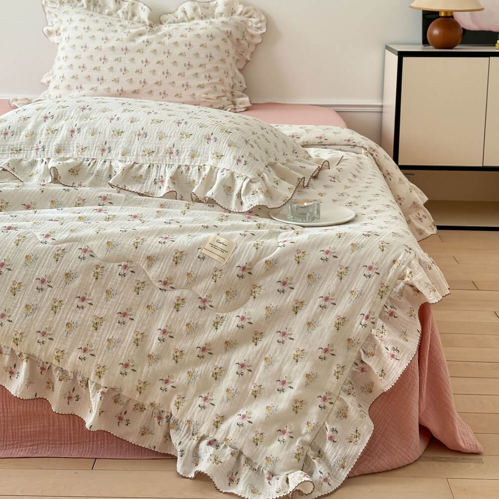 cottage style floral muslin quilt on bed, airy cotton gauze