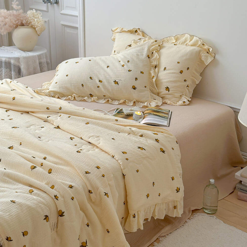 Lemon muslin quilt on bed, lightweight cotton bedding