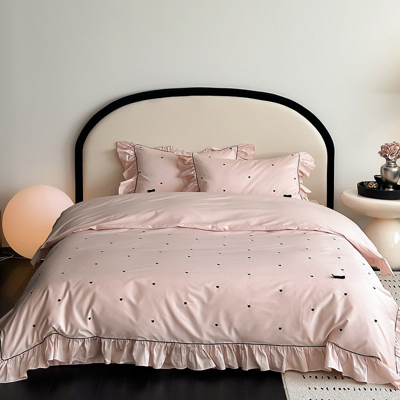 Pillowcase with ruffles and heart embroidery in pink bedding set