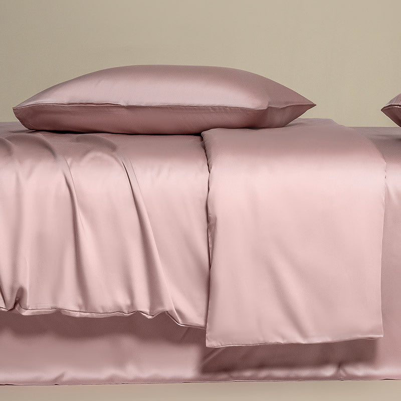 Satin Silky Lyocell Bedding Set in a luxurious rose pink hue, showcasing the smooth, silky texture and elegant finish of the fabric.
