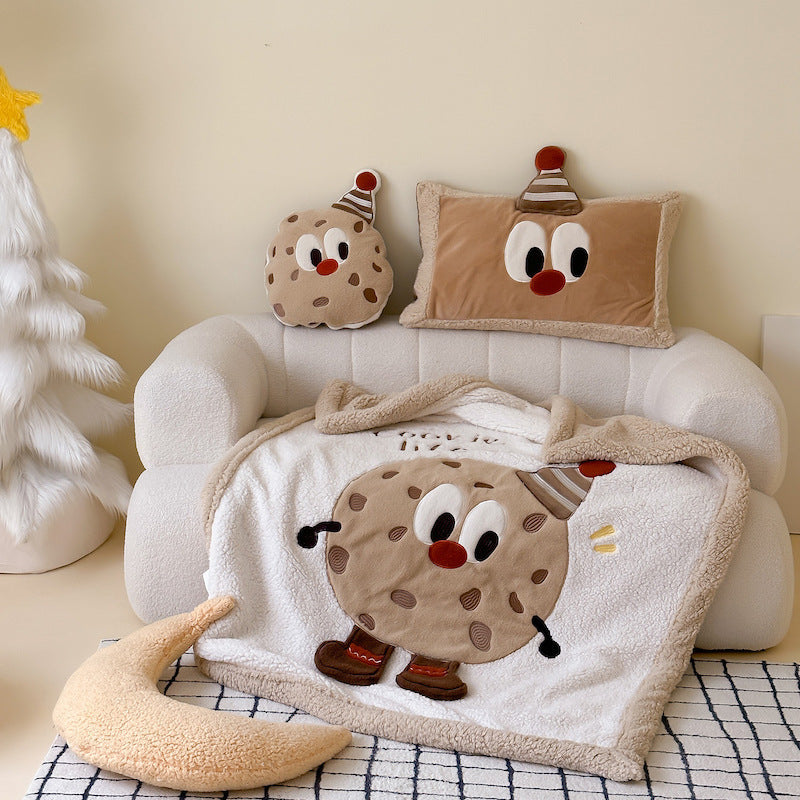 A cozy food-themed plush sherpa baby blanket with a cookie character, suitable for winter.