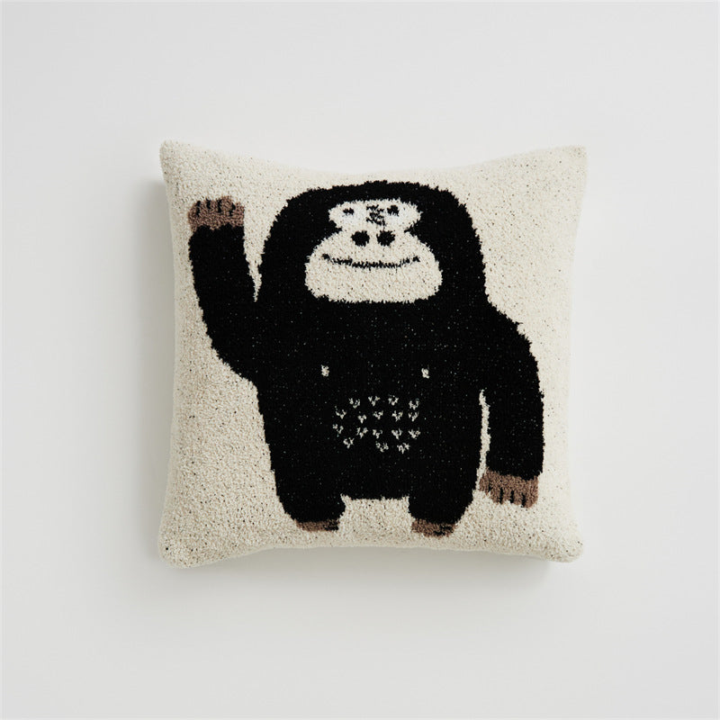 A black and white chimpanzee "Hello" design pillowcase on a white background, showcasing the short plush material.