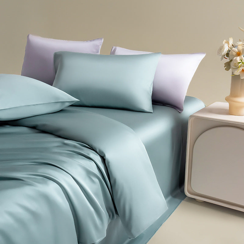 Silk-like silky Lyocell bedding set in a beautiful mint greey, styled with soft matching pillows for an elegant, calming aesthetic.